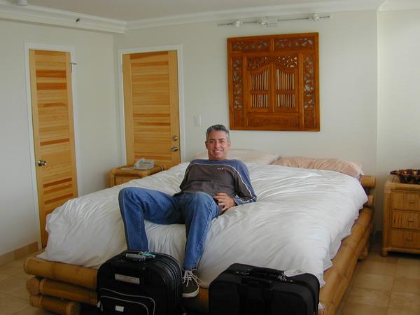 Kirk sitting on the bed in honolulu