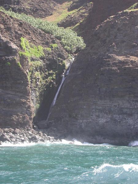 A waterfall close to shore