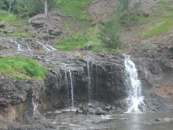 Small waterfall trickling into the ocean