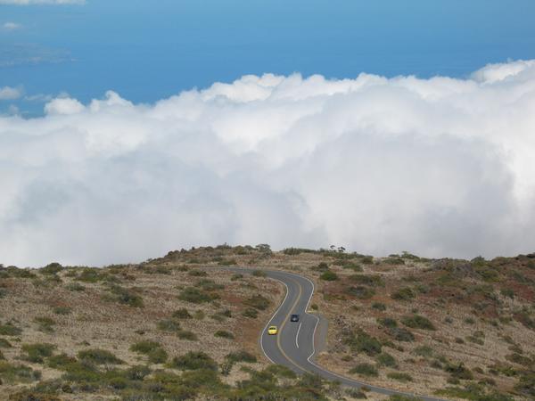 11 00 the highway still snakes its way, the clouds encroaching
