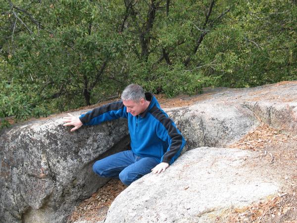 Kirk sitting in the rocks