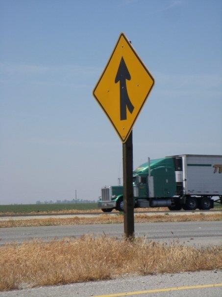 Merge sign and oncoming big rig 20121216 1600383386