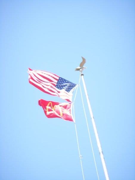 Overexposed view of the mcdonald s flag flying bel 20121216 1455650334