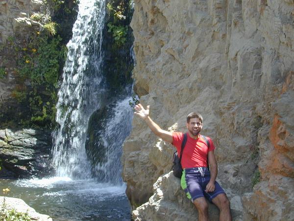 Marco waving one handed at the upper falls