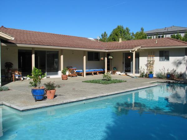 The back yard and the pool from the corner