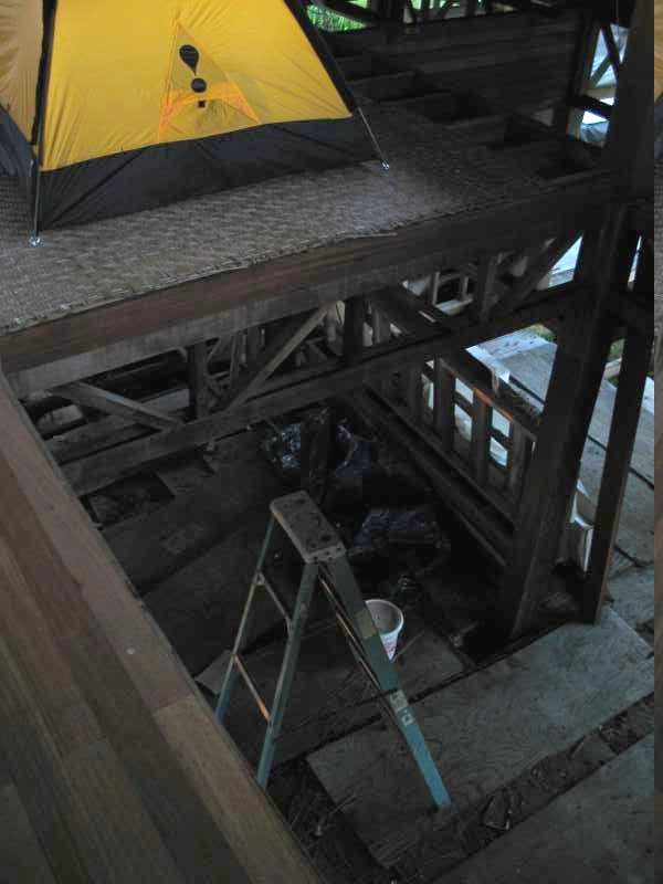 Climbing up the ladder to the tent