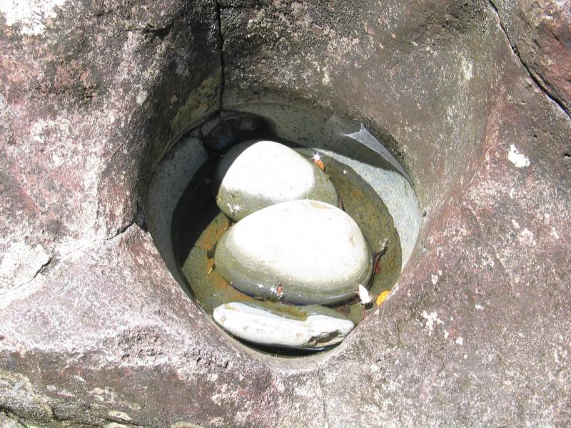 Rocks grinding a hole