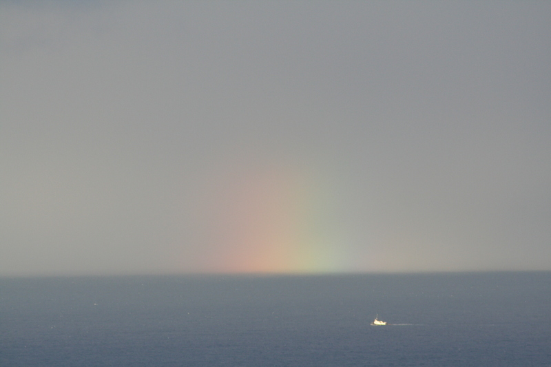 A rainbow splotch in the sea